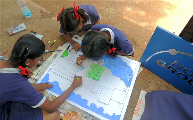 Schulkinder visualisieren die Bedeutung von sauberem Wasser. Foto: NORMA